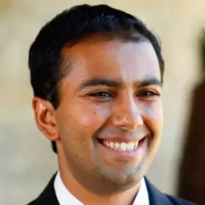 Profile picture of a  man in a suit